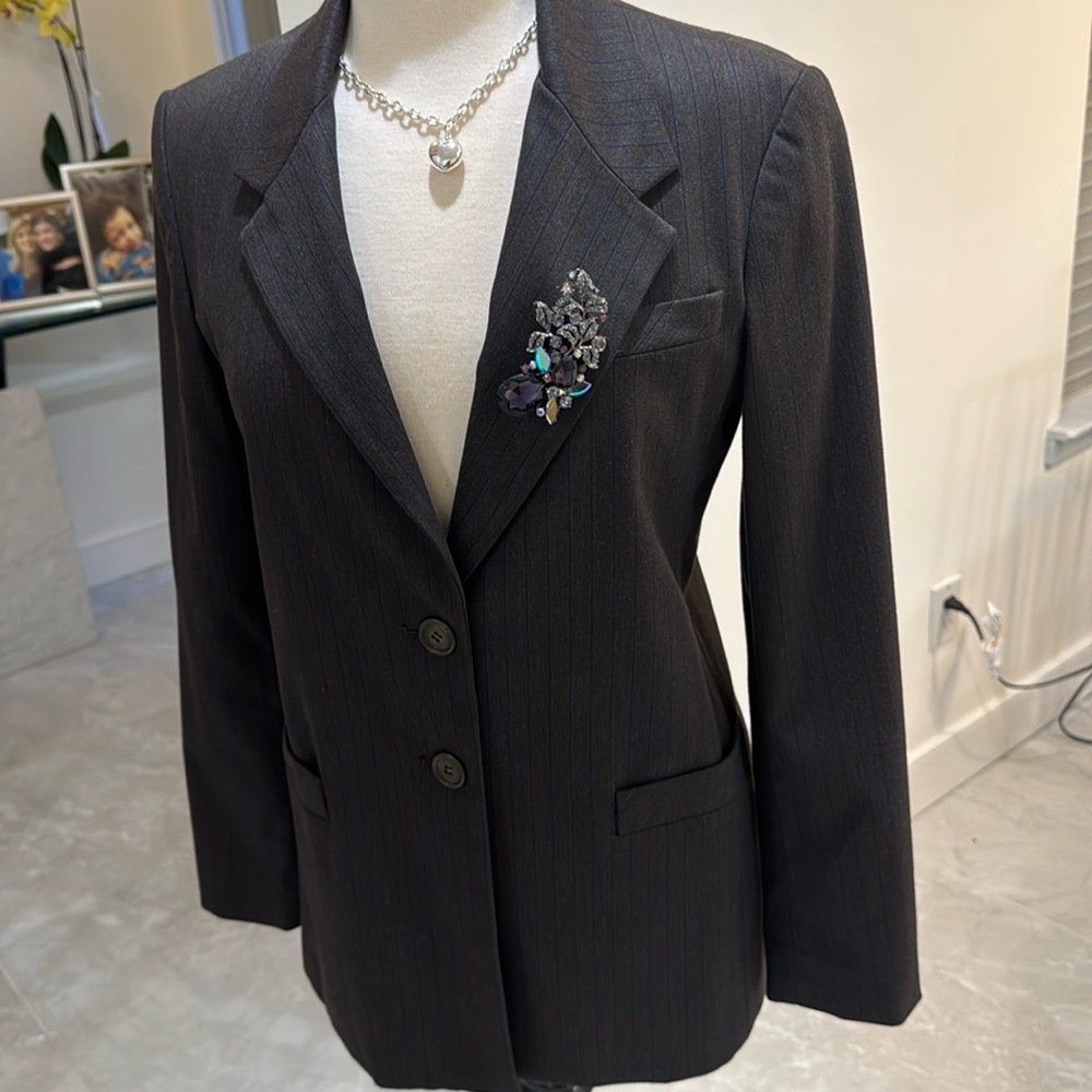Charcoal gray blazer with blue stripes.